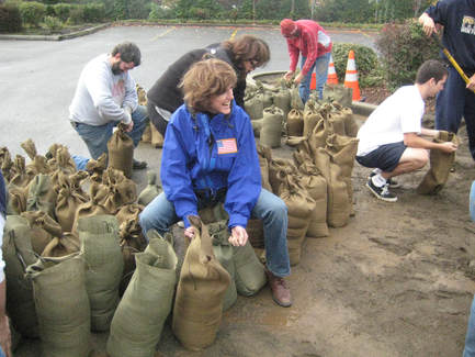 Susan Hutchison filling sandbags image